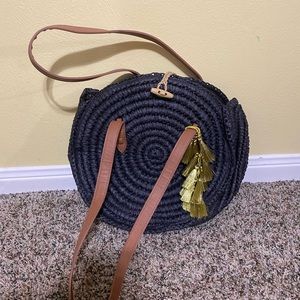 Black straw shoulder bag with gold tassel